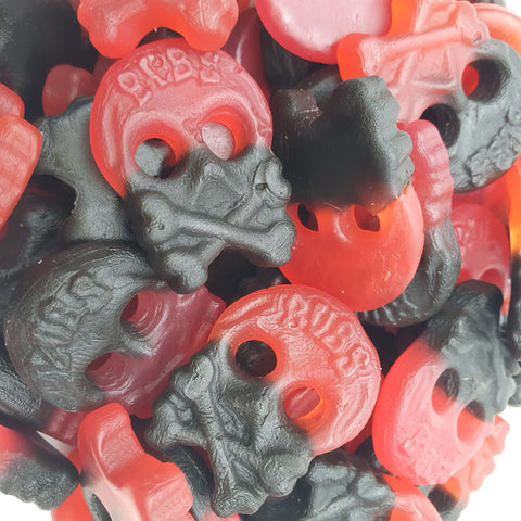 close-up of red and black raspberry liquorice skulls