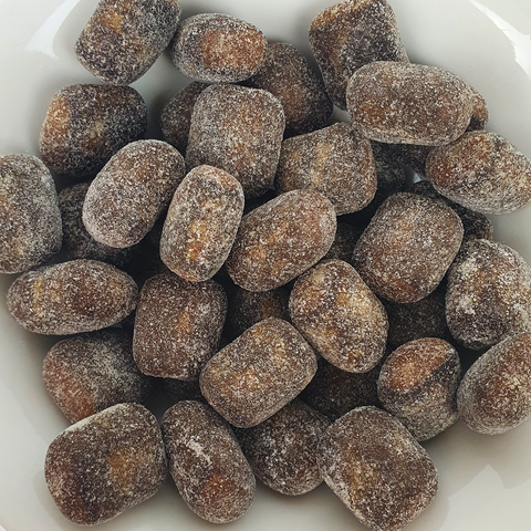 close-up of individual salmiak liquorice sweets