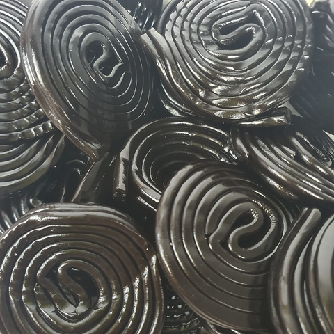 close-up of black liquorice wheels